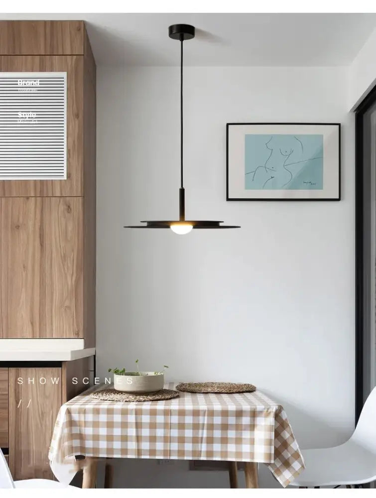 DecorBites™ LED Nordic flying saucer chandelier with a black minimalist disc-shaped shade and thin cord suspension