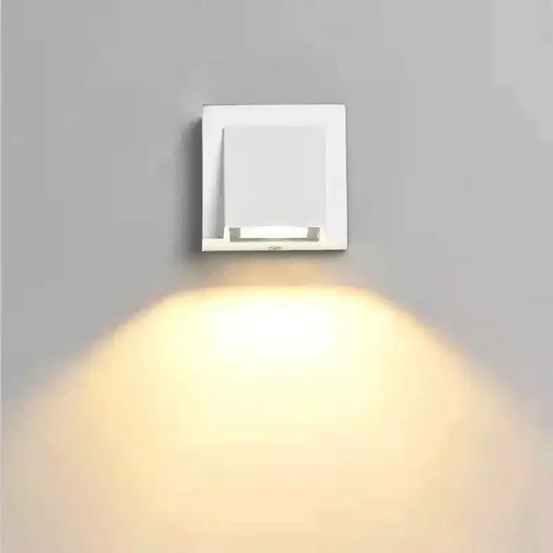 Modern white square wall light with sleek minimalist design emitting warm light for DecorBites led outdoor porch use