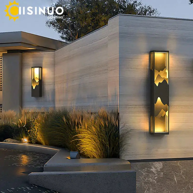 DecorBites led outdoor wall lamp with sleek black frame and golden mountain design emitting warm ambient light for garden use