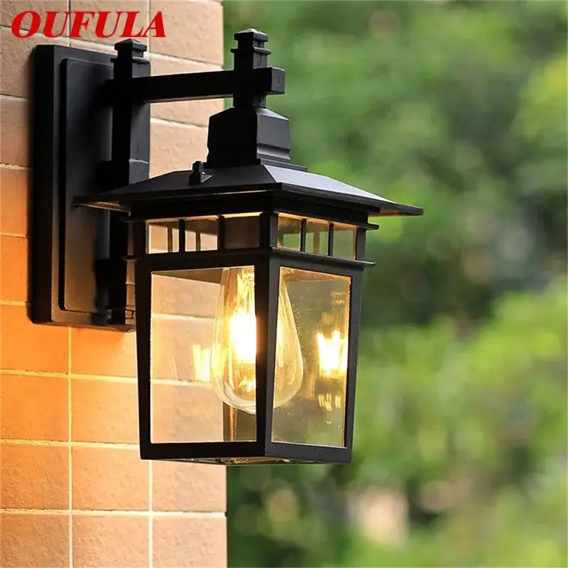 Black wrought iron decorbites led outdoor wall lamp with clear glass panels and exposed filament bulb for outdoor use