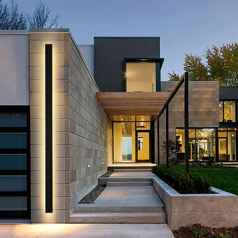 Modern minimalist decorbites led outdoor wall light in sleek black with warm ambient glow for porch and garden lighting