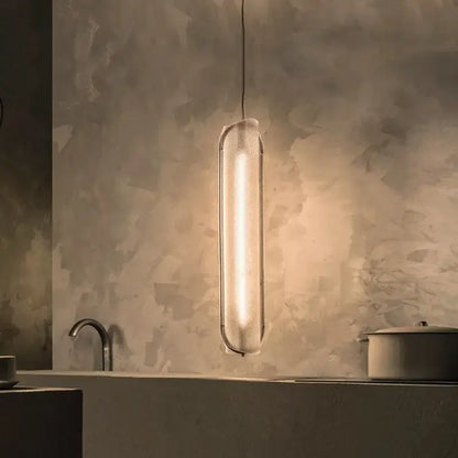 A sleek decorbites led pendant lamp with textured glass shade and metallic frame for modern home and office lighting