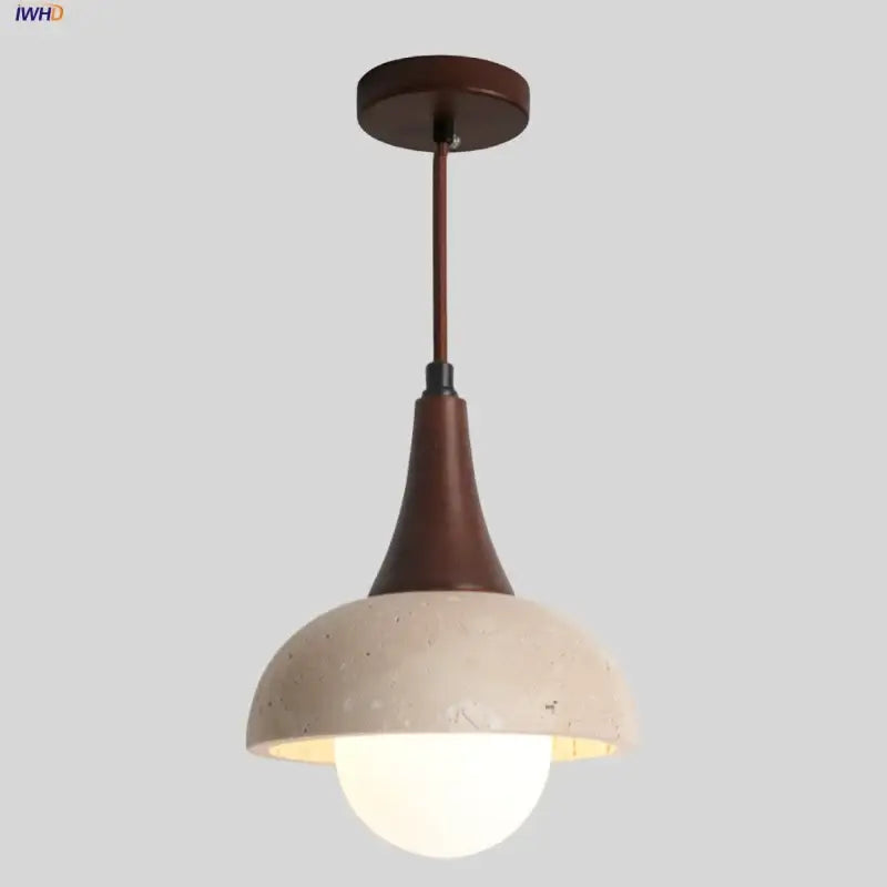 Decorbites led pendant lamp with matte brown metal stem and off-white concrete dome encasing glowing white glass ball bulb