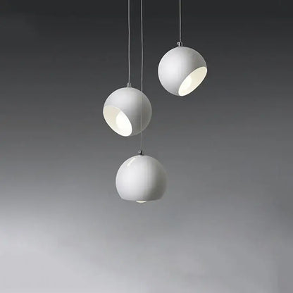 Three white spherical matte pendant lights with subtle metallic accents in the DecorBites LED pendant lamp 2023 collection