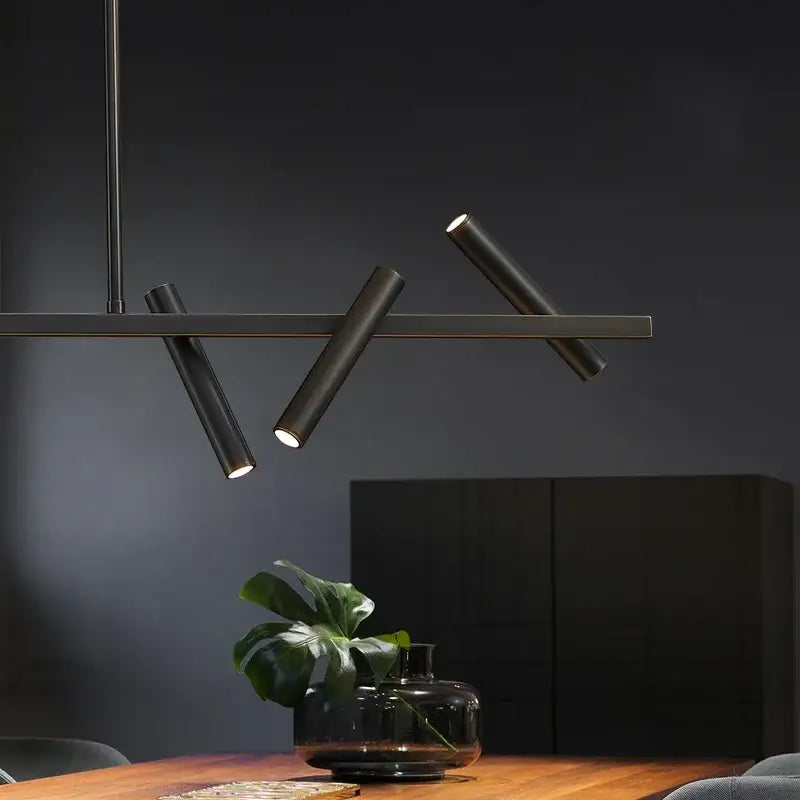 Modern black metal pendant light with angled cylindrical arms and warm led bulbs from DecorBites LED pendant light collection
