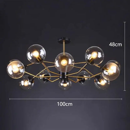 Modern chandelier pendant lights with a gold-toned metal frame and clear glass globe bulbs by DecorBites led pendant