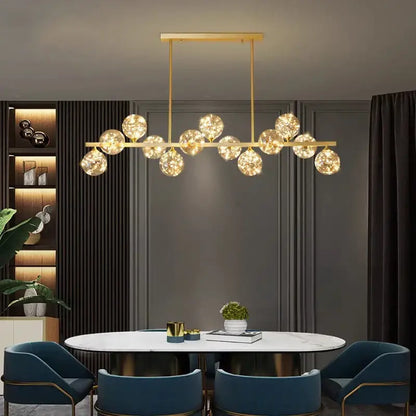 Gold-toned DecorBites led pendant light chandelier with multiple spherical glass globe lights for modern indoor decor