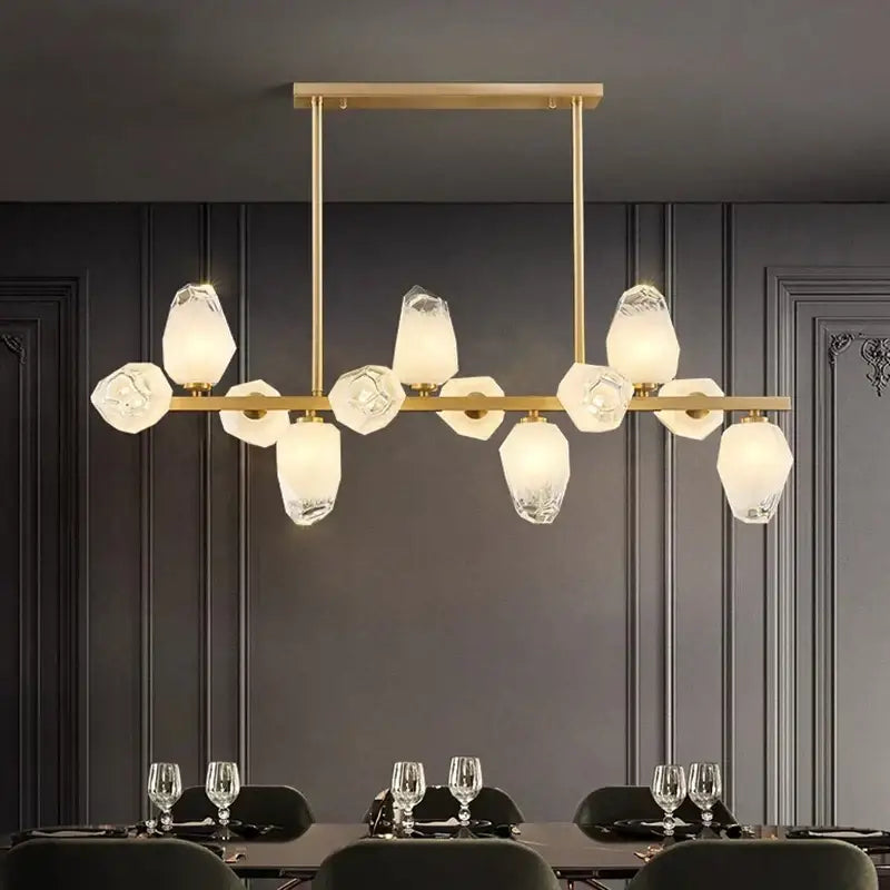 Gold-toned decorbites led pendant light chandelier with faceted translucent glass shades in modern geometric pattern