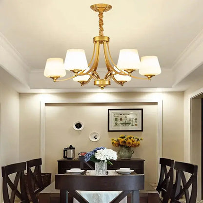 Gold-toned DecorBites led pendant chandelier with six frosted glass shades and ornate twisted metal arms for modern lighting