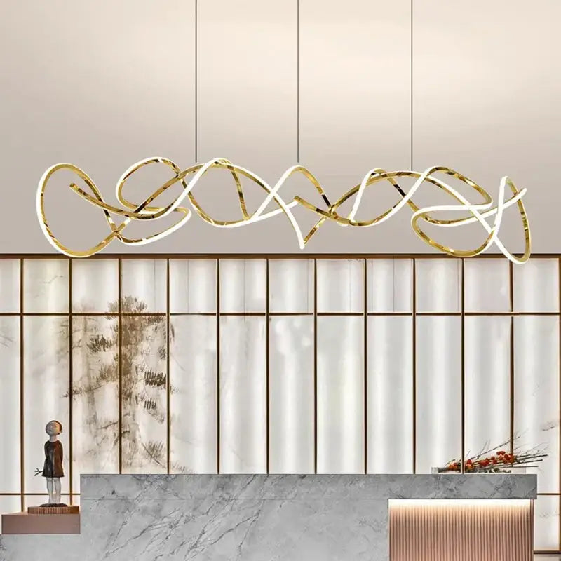 Gold-toned decorbites led pendant light chandeliers with intricate flowing design for modern living and dining rooms lighting