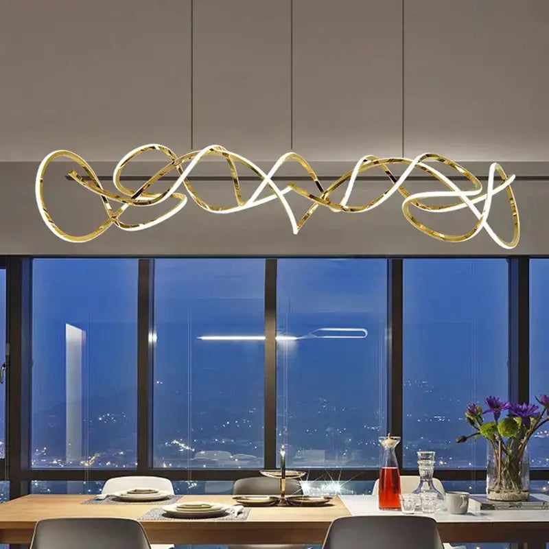 Gold-toned decorbites led pendant with intricate flowing design for modern living and dining room lighting