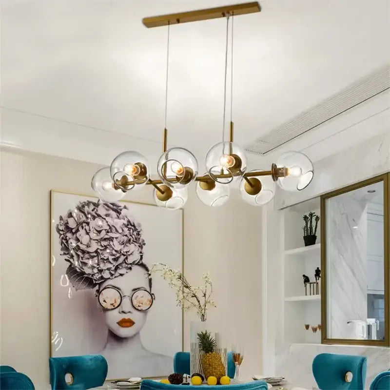 Modern brass DecorBites LED pendant light chandelier with clear glass globe bulbs for living room and dining room lighting