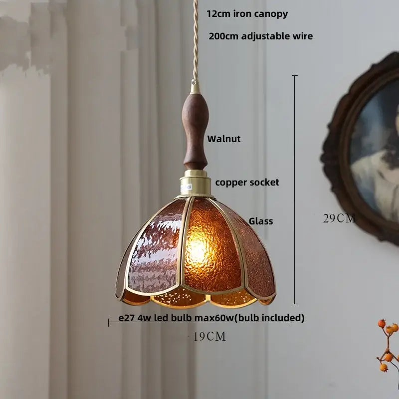 A warm amber glass pendant light with walnut handle and brass accents by DecorBites led pendant light fixture