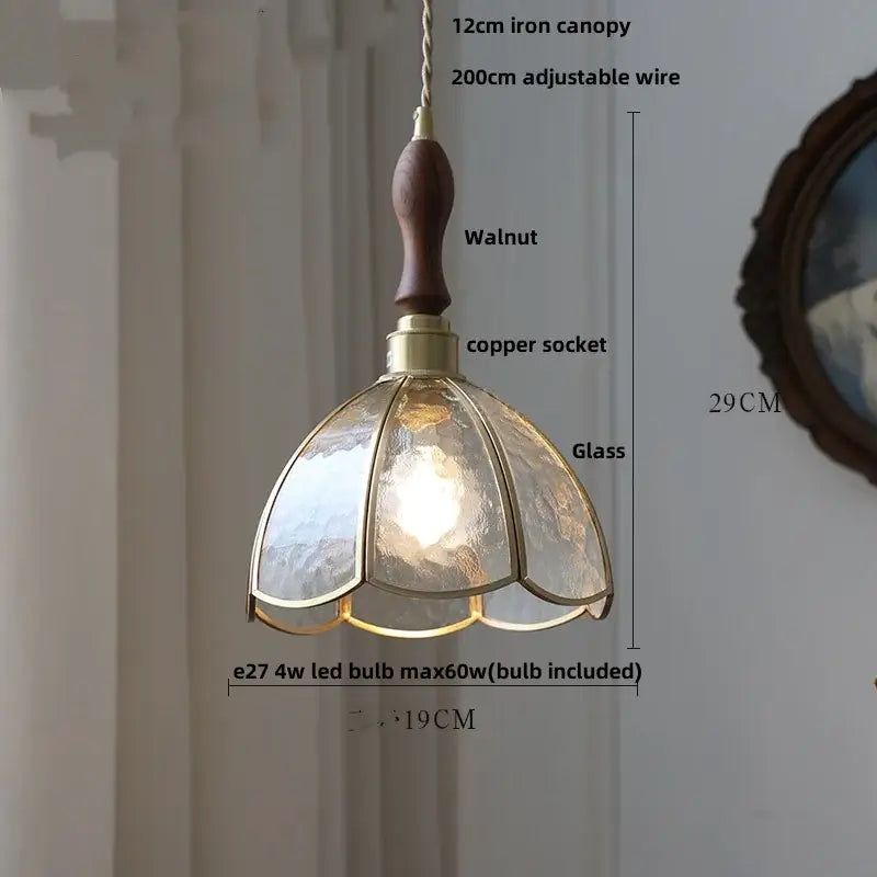 A warm-toned decorbites led pendant light with walnut wood handle brass accents and textured glass panels for modern decor