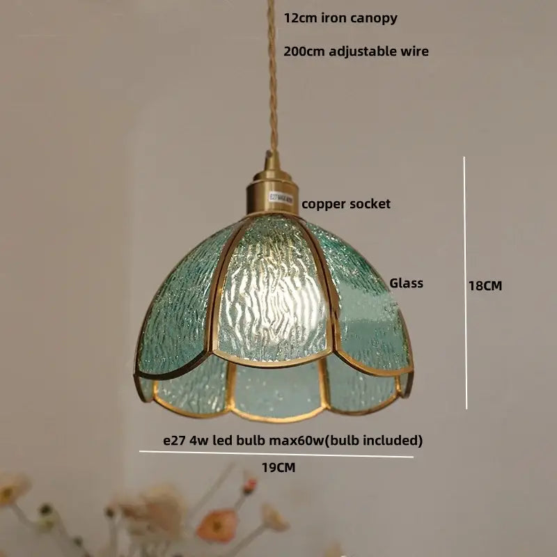 A delicate teal glass DecorBites LED pendant light with brass frame and copper socket for modern living and dining rooms