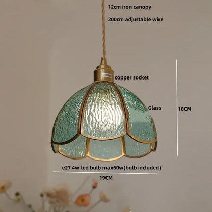 A delicate teal glass DecorBites LED pendant light with brass frame and copper socket for modern living and dining rooms