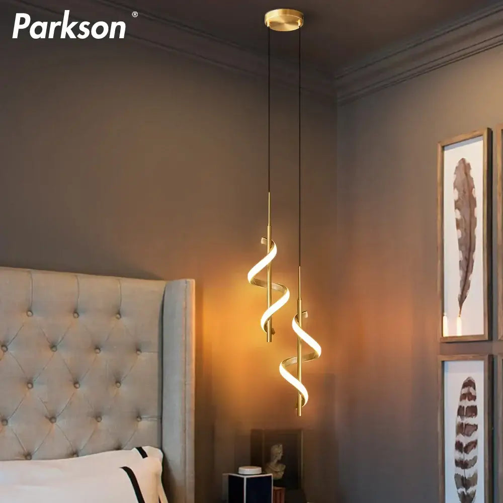 Gold-toned Parkson spiral pendant light with sleek modern design and warm ambient glow for DecorBites LED pendant light