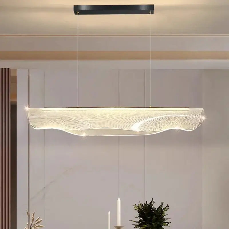 Modern decorbites led pendant light with sleek black mount and wave-patterned diffuser for living and dining rooms