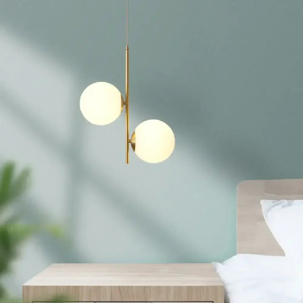 Gold-toned decorbites led pendant light with two frosted glass globes suspended from a slender rod for modern home decor