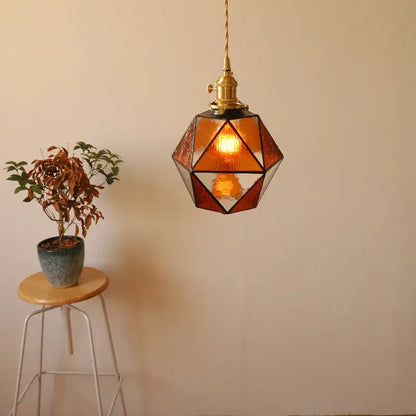 Decorbites led pendant light with warm amber geometric shade brass hardware and twisted cord for bedroom or dining room