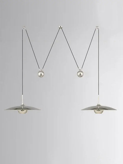 Silver metallic decorbites led pendant lights with circular shades and curved suspension cords for bedroom and dining room