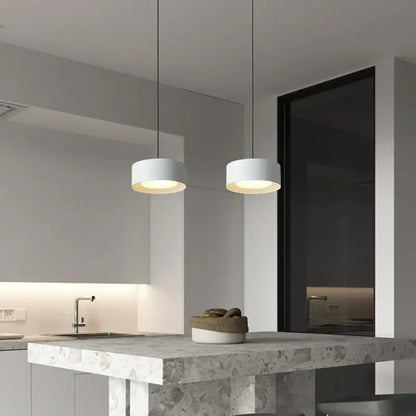 Two minimalist white cylindrical decorbites led pendant lights with matte finish and warm glow for living spaces