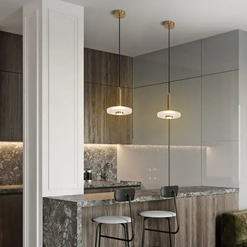 Two elegant gold-finished decorbites led pendant lights with frosted acrylic glass shades for indoor home decor lighting