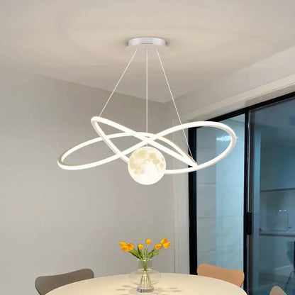 Modern white DecorBites LED pendant lights with intertwined circular rings and a glowing moon pendant for indoor use