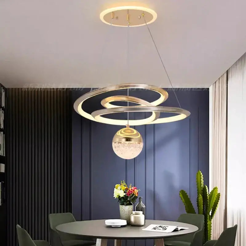 Modern gold-toned decorbites led pendant light with textured glass globe ideal for living and dining room decor