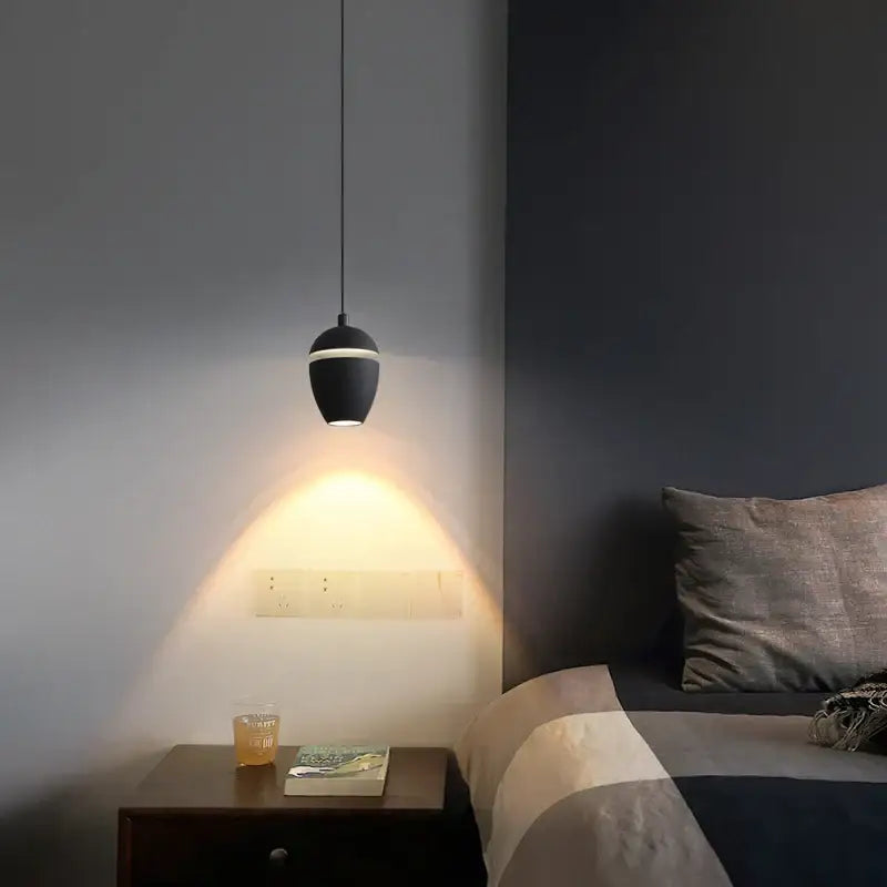 Black decorbites led pendant light with sleek teardrop design and thin white accent band for modern interior lighting