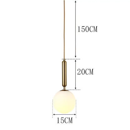 A modern brass-finished pendant light with frosted glass globe for dining room by decorbites led pendant lights