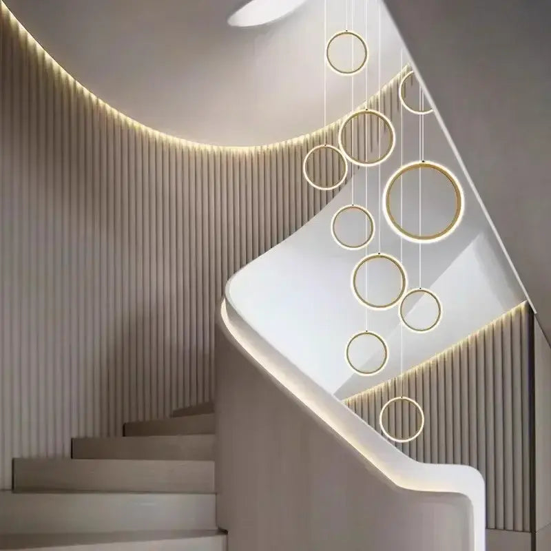 Modern gold-toned led pendant lights with circular illuminated edges by decorbites for living and dining rooms
