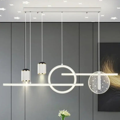 Modern white led pendant lights with geometric cylindrical and circular fixtures accented by gold trim by DecorBites