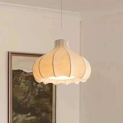 A warm-toned pleated paper decorbites led pendant light with a soft glow enhancing home lighting brilliance