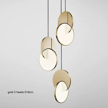Modern gold-toned decorbites led pendant light with three overlapping circular heads and frosted glass centers