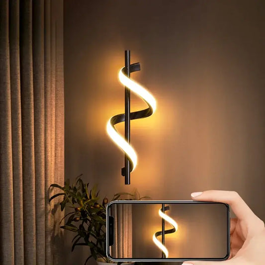 Black spiral wall lamp with warm glowing led light strip from DecorBites led pendant lights for modern Nordic decor