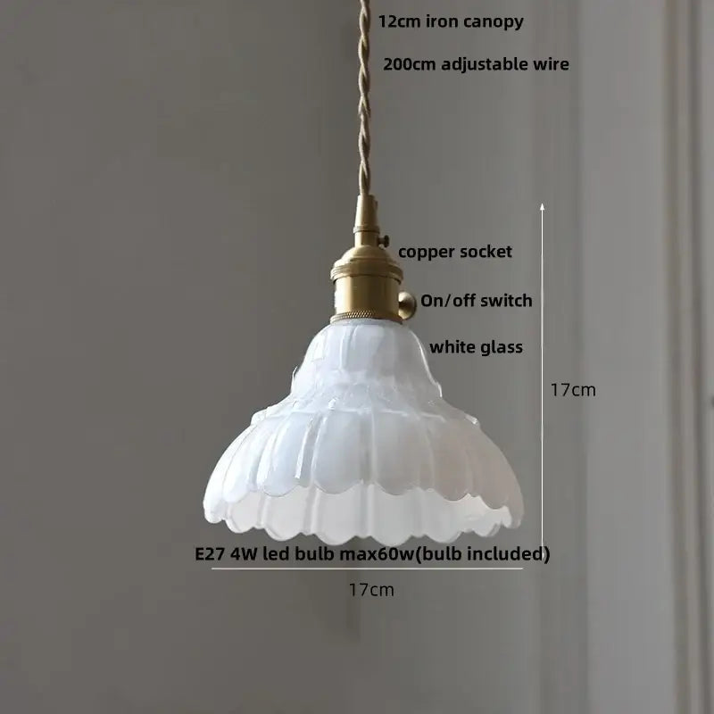 A delicate white glass pendant light with fluted design and brass-finished copper socket from DecorBites led pendant