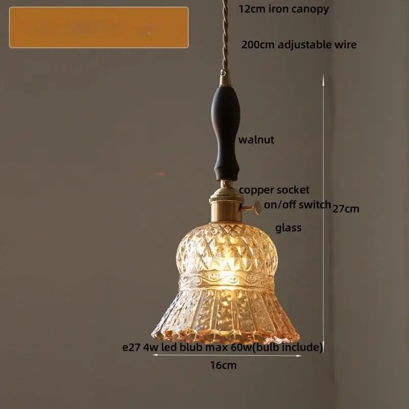 A warm amber-lit faceted glass pendant light with brass accents from decorbites led pendant lights collection