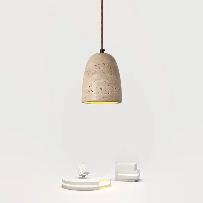 Beige concrete decorbites led pendant light with textured speckled surface and warm yellow interior glow