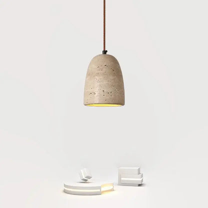 Beige concrete decorbites led pendant light with textured speckled surface and warm yellow interior glow