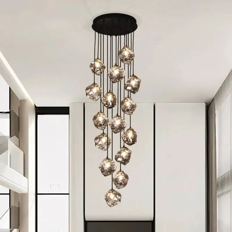 A decorbites led pendant light with black circular mount and warm crystal glass orbs for led pendant staircase lighting