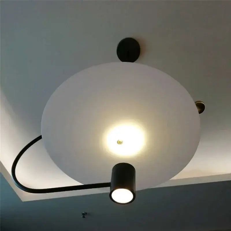 Modern black and white decorbites led pendent with frosted glass globe and adjustable spotlight arm pendant light