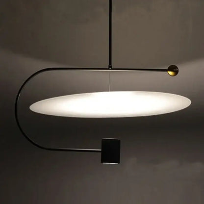 DecorBites™ modern minimalist pendant light fixture with black metal frame, frosted glass shade, and brass accent for indoor use