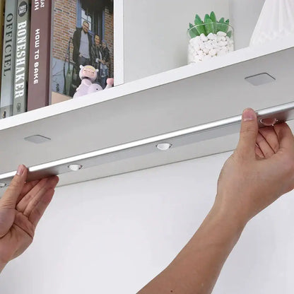 Silver metallic DecorBites LED PIR motion sensor cabinet light with three circular bulbs and two square mounting tabs