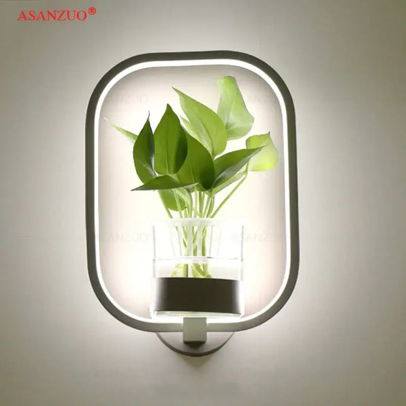 Decorbites™ led plant wall lamps featuring modern silver oval wall lamps with clear glass vase and vibrant green plant