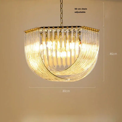 A decorbites led postmodern semi-circular chandelier with clear glass prisms and a gold silver metal frame for foyers