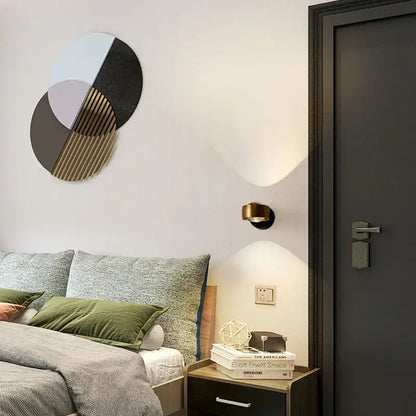Modern circular decorbites led projection wall lamp featuring geometric black and gold slats with pastel hues for living room use