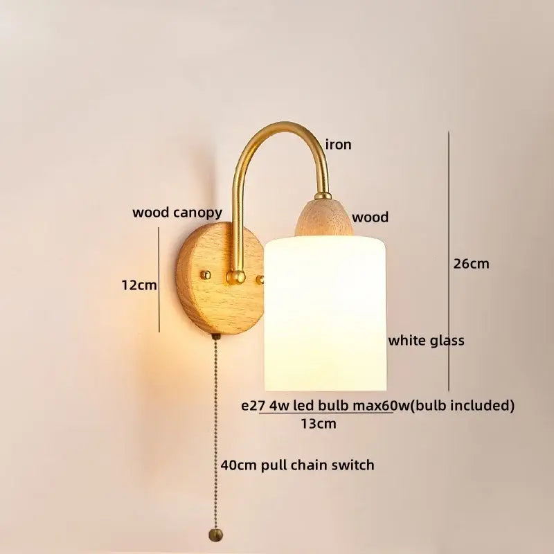 A warm-toned decorbites led pull wall light with brass iron arm wooden base white frosted glass shade and pull chain switch