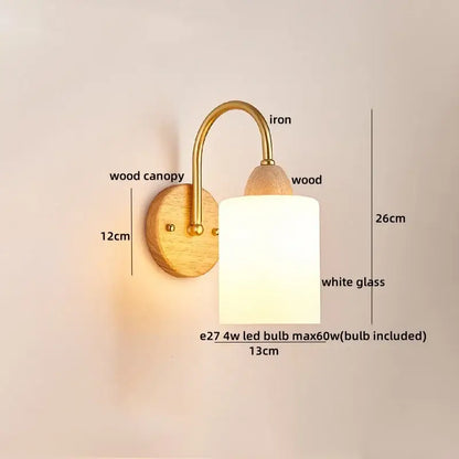 A warm-toned decorbites led pull wall light with brass iron arm, wood canopy, and white glass shade for bedroom decor