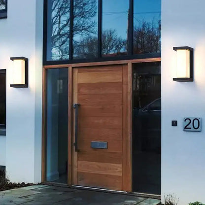 Modern wooden front door with horizontal slats and sleek metal handle illuminated by decorbites led radar induction wall lamp